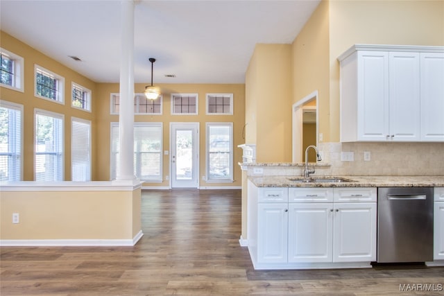 kitchen featuring hardwood / wood-style floors, sink, and white cabinets