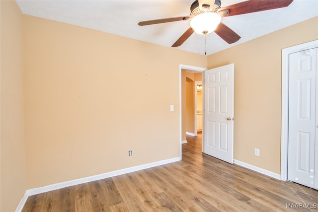 unfurnished bedroom featuring light hardwood / wood-style floors and ceiling fan