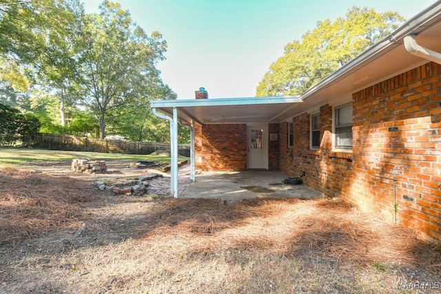 exterior space with a carport