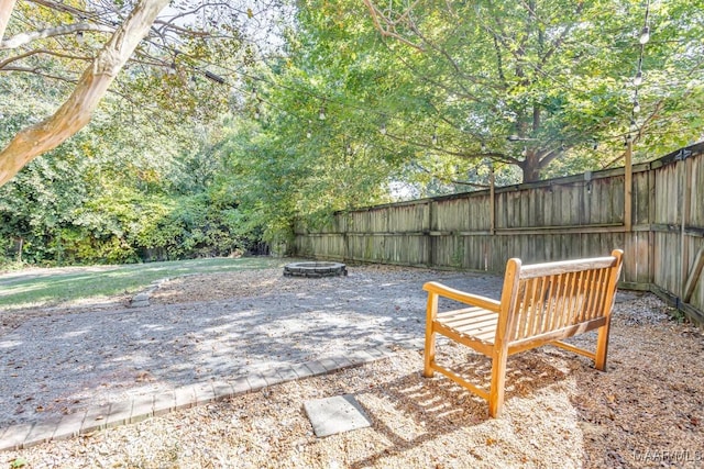 view of patio / terrace featuring a fenced backyard and an outdoor fire pit