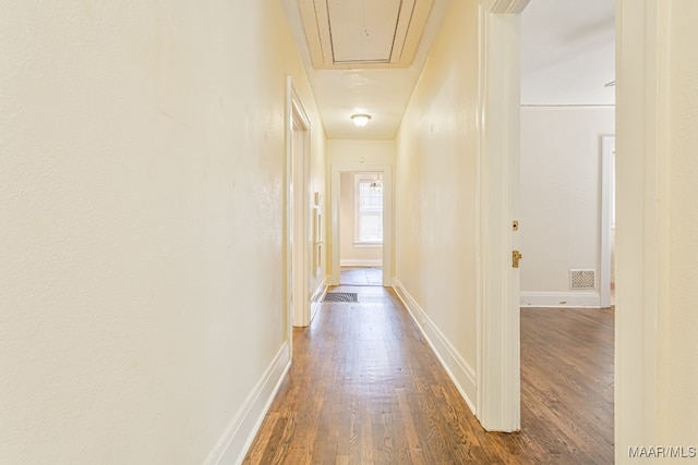 hall with dark hardwood / wood-style floors