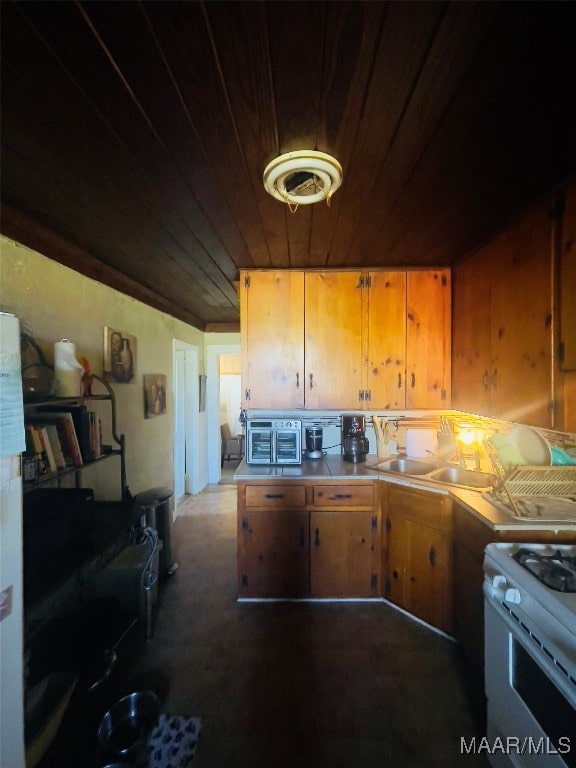 kitchen with sink, wooden ceiling, and white range oven