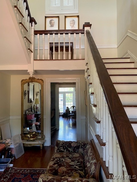 staircase with hardwood / wood-style flooring