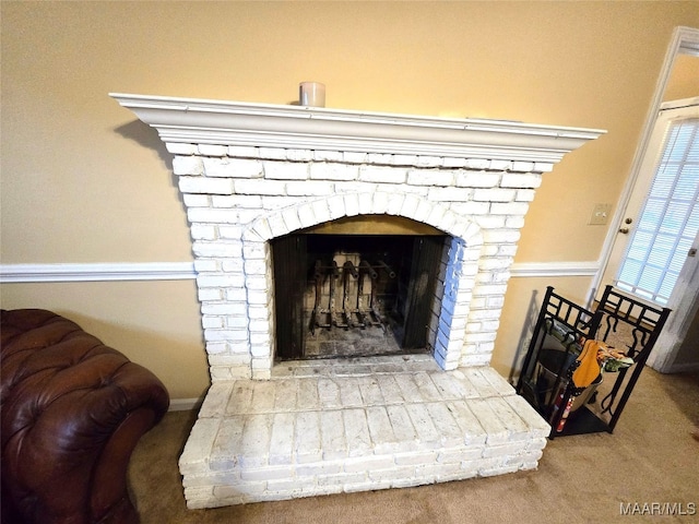 room details with carpet flooring and a brick fireplace