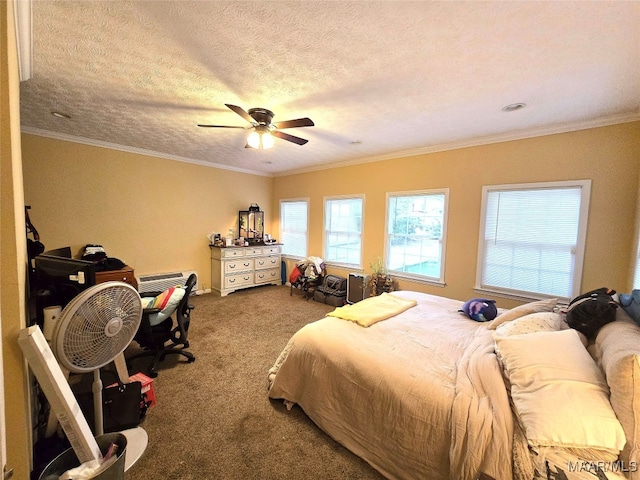 carpeted bedroom featuring ceiling fan, crown molding, and a textured ceiling