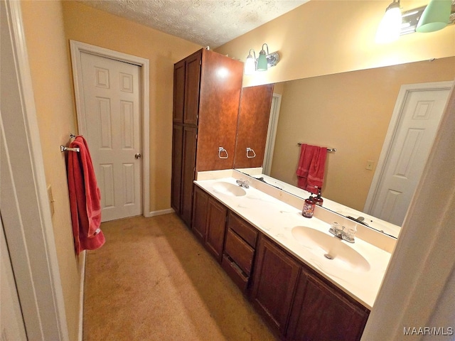 bathroom featuring vanity and a textured ceiling