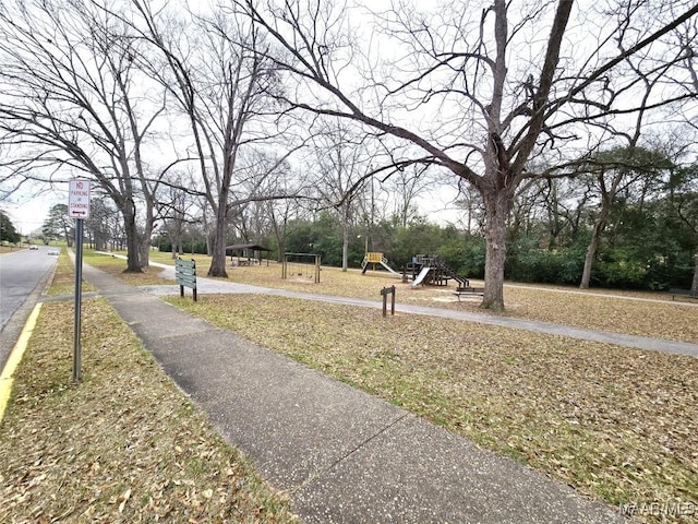 view of road with traffic signs and sidewalks