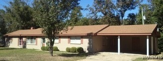 view of front facade with a carport