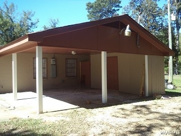 back of property featuring a carport