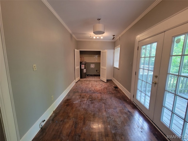 corridor featuring ornamental molding, dark wood-type flooring, electric water heater, and french doors