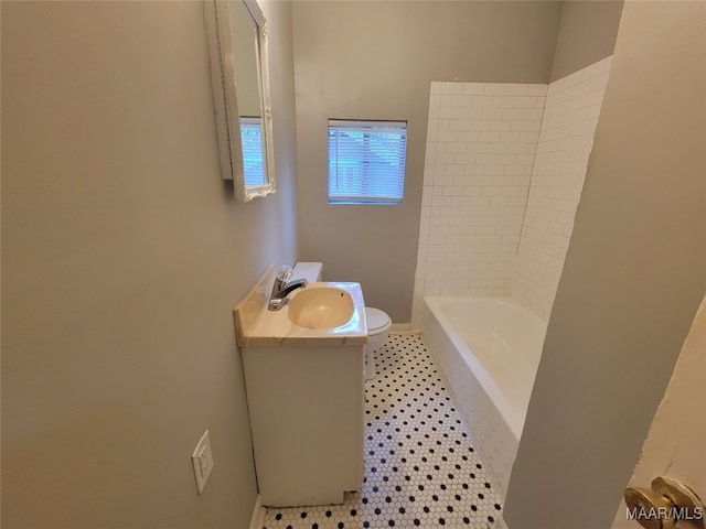 bathroom with vanity, toilet, and tile patterned floors