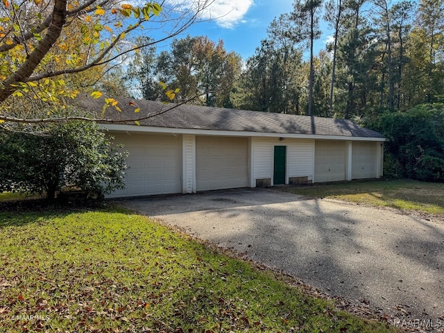 garage with a lawn