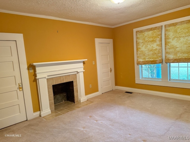 unfurnished living room featuring carpet, a textured ceiling, a tile fireplace, and crown molding