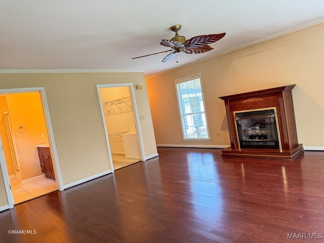 unfurnished living room featuring ceiling fan, wood-type flooring, and crown molding