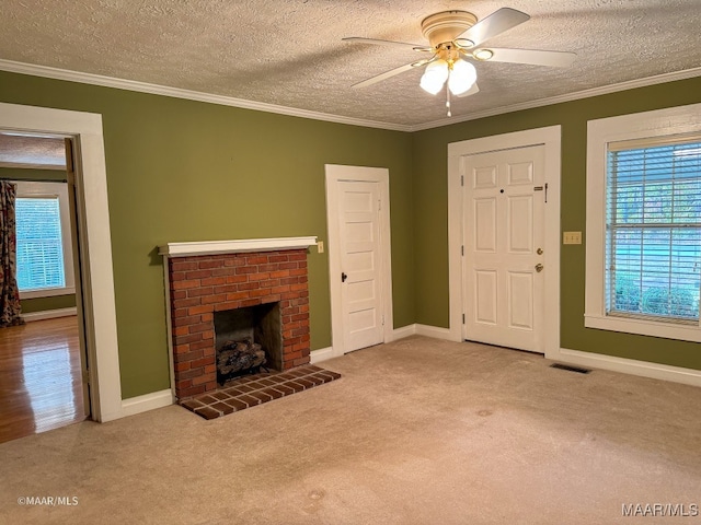 unfurnished living room featuring light carpet, crown molding, ceiling fan, and a brick fireplace