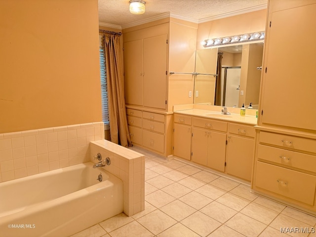 bathroom featuring tile patterned floors, a bathing tub, a textured ceiling, and ornamental molding