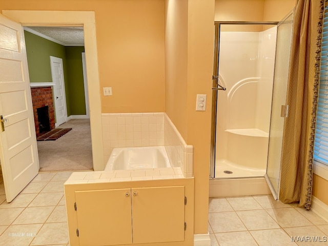 bathroom featuring tile patterned floors, separate shower and tub, a fireplace, and a textured ceiling