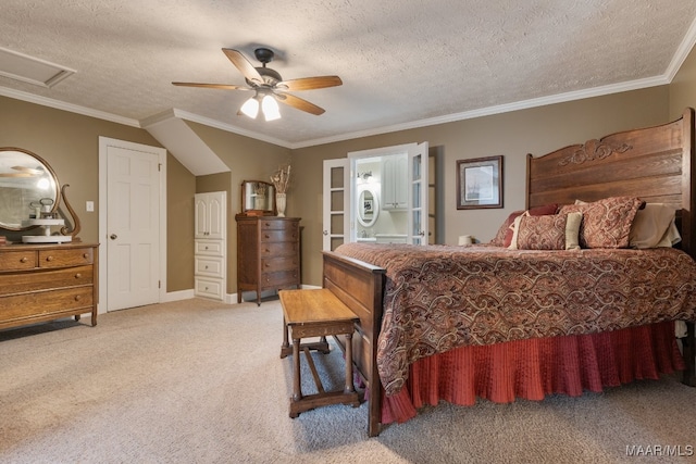 bedroom featuring ensuite bath, a textured ceiling, ceiling fan, ornamental molding, and light colored carpet