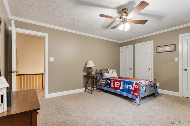 bedroom with ceiling fan, carpet flooring, a textured ceiling, and crown molding