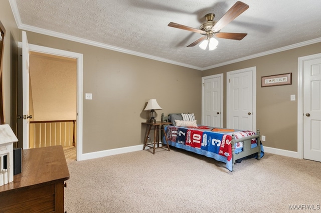 carpeted bedroom with crown molding, a textured ceiling, and ceiling fan