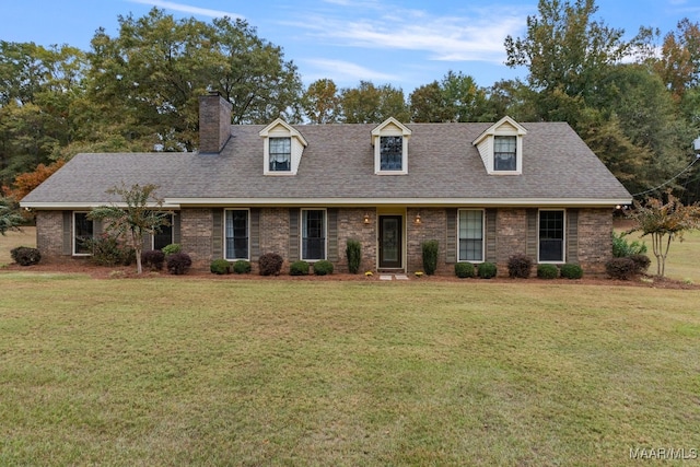 cape cod house featuring a front lawn