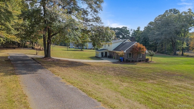 view of property exterior featuring a lawn