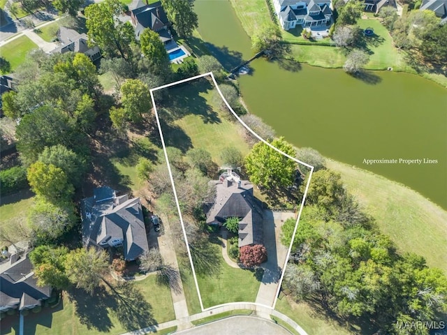 drone / aerial view with a water view and a residential view