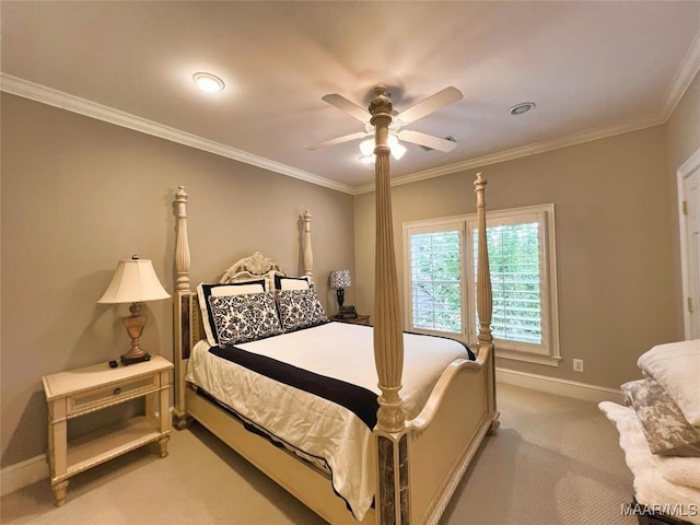 bedroom featuring light carpet, baseboards, ornamental molding, and ceiling fan