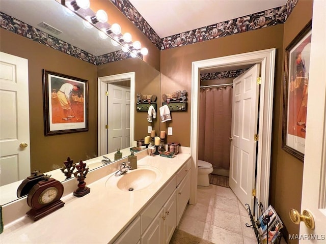 bathroom with visible vents, toilet, a shower with curtain, tile patterned floors, and vanity