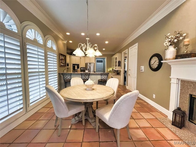 dining area featuring a high end fireplace, light tile patterned flooring, crown molding, and an inviting chandelier