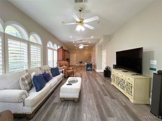 living room with ceiling fan and wood-type flooring