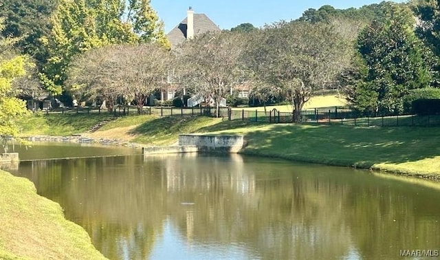 view of water feature with fence