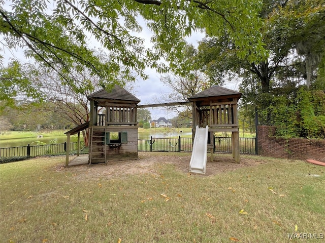 view of jungle gym featuring a fenced backyard and a lawn