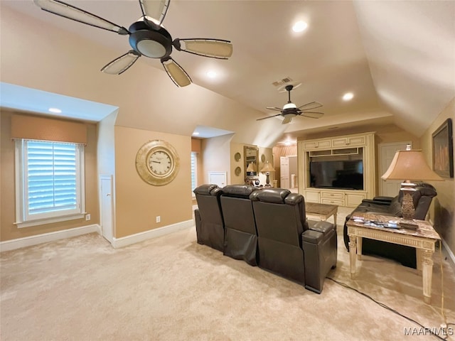 home theater with recessed lighting, a ceiling fan, light carpet, vaulted ceiling, and baseboards