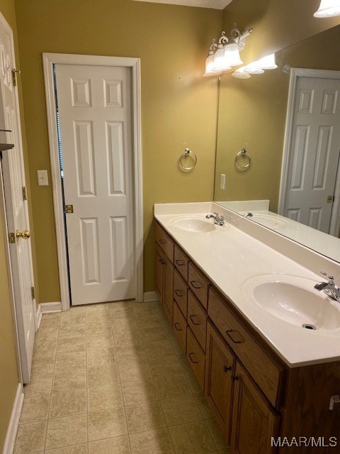 bathroom with vanity and tile patterned flooring