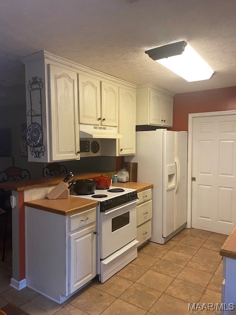 kitchen with white cabinetry, a textured ceiling, white appliances, and light tile patterned floors