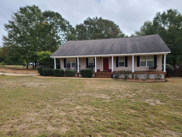 ranch-style home featuring a front yard and a porch