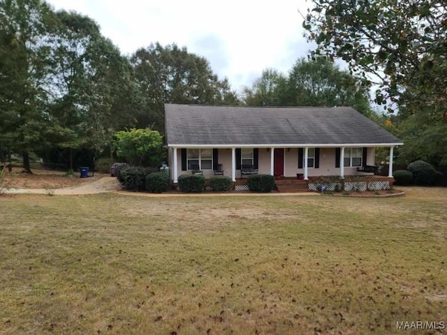 view of front facade featuring a front lawn and covered porch