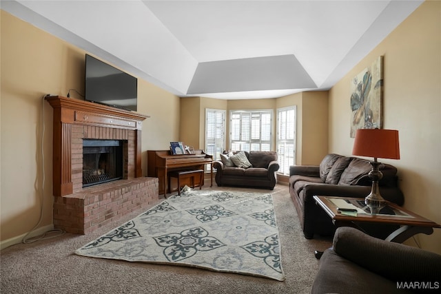 carpeted living room featuring a brick fireplace