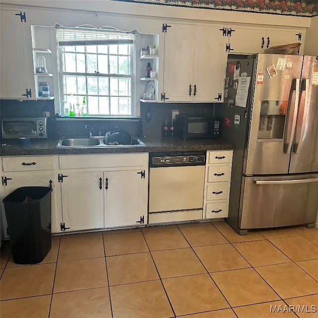 kitchen featuring white cabinets, backsplash, stainless steel fridge with ice dispenser, dishwasher, and sink