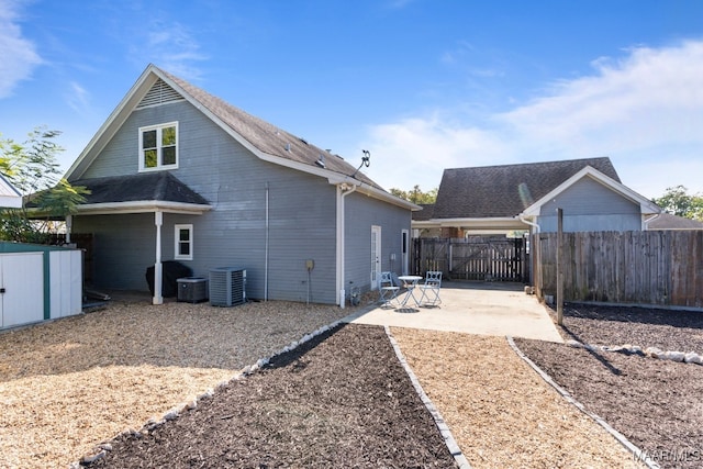 back of house with a patio and cooling unit