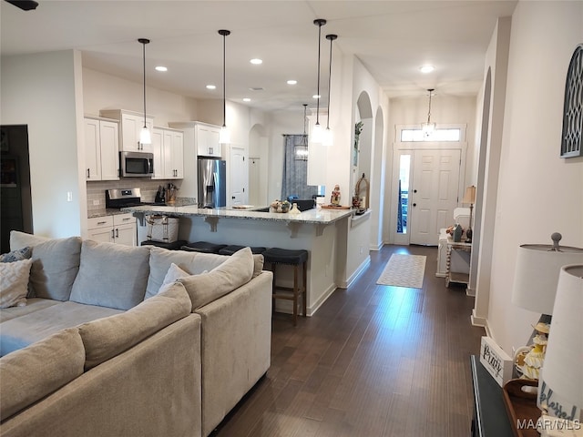 living room with dark wood-type flooring