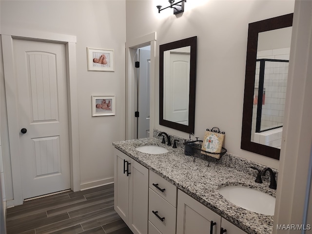 bathroom featuring wood-type flooring and vanity