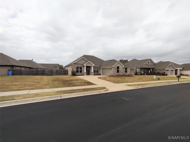 view of front of home featuring a garage and a front lawn