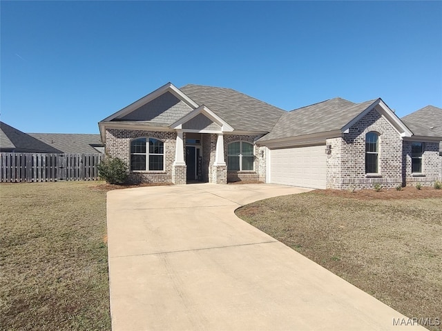 view of front facade featuring a front lawn and a garage