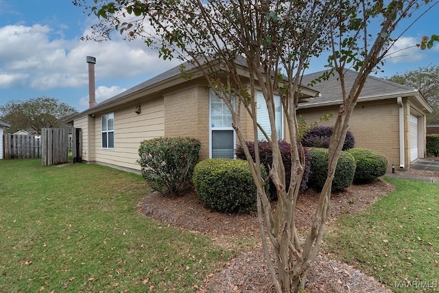 view of home's exterior with a lawn