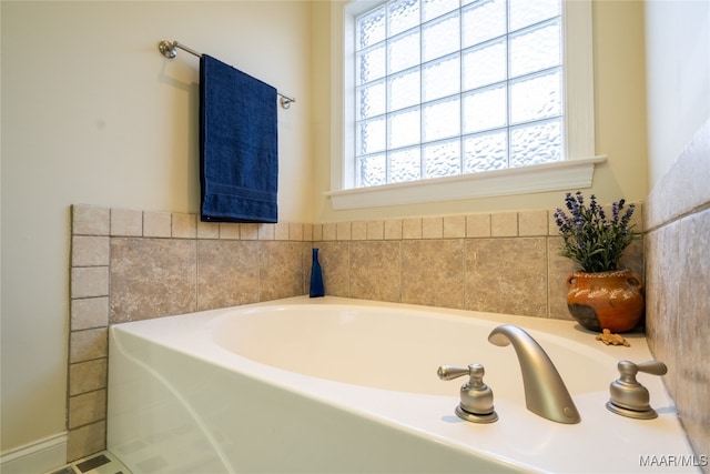 bathroom featuring a bath