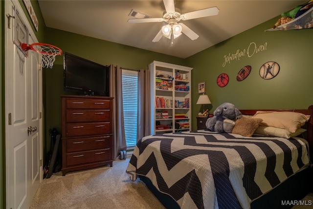 bedroom with ceiling fan and light carpet