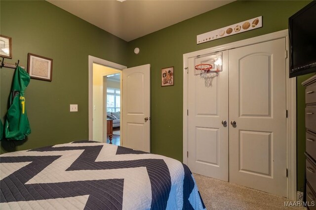 carpeted bedroom with a closet