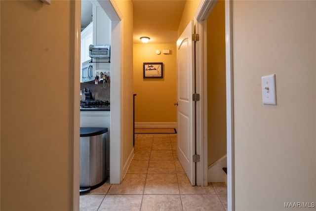 5612 New Harvest Dr, Montgomery, AL 36116 - hallway featuring light tile patterned floors and baseboards